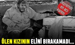 En acı fotoğraf: Ölen kızının elini bırakamayan baba