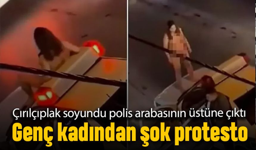 Bir kadın kıyafetlerini tamamen çıkarıp polis arabası üstüne çıktı